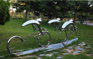 ride on a bicycle sculpture